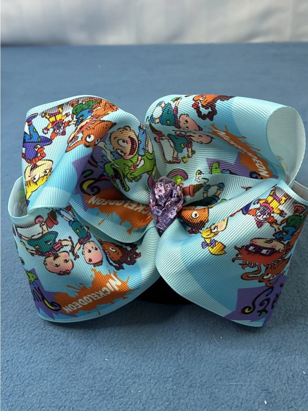 Nickelodeon Rugrats Print Light Blue Hair Bow with Purple Gem